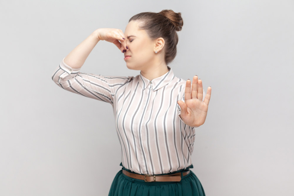 person covering their nose