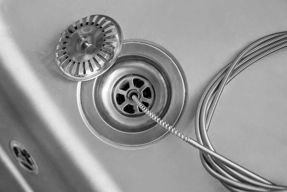 hydro jet nozzle and drain snake side by side / drain snaking
